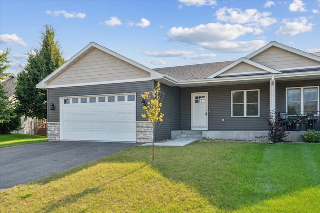 view of front of home with a garage and a front yard