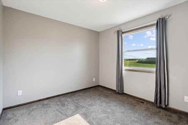 unfurnished room featuring carpet flooring