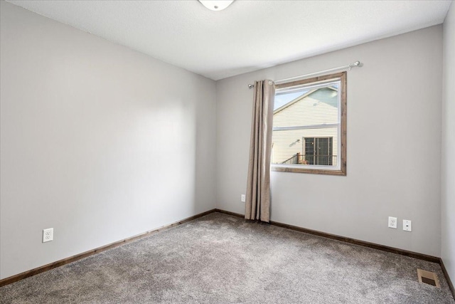 unfurnished room with carpet flooring