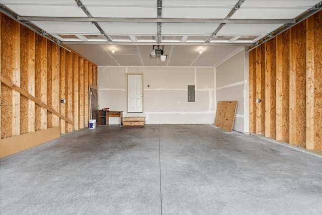 garage featuring a garage door opener and electric panel