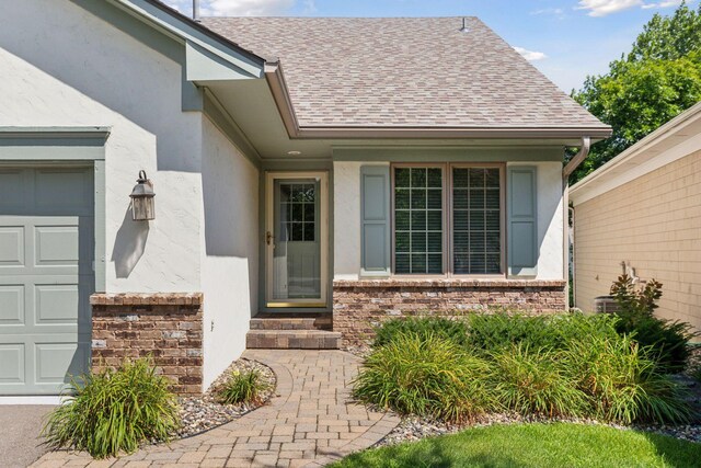 property entrance with a garage