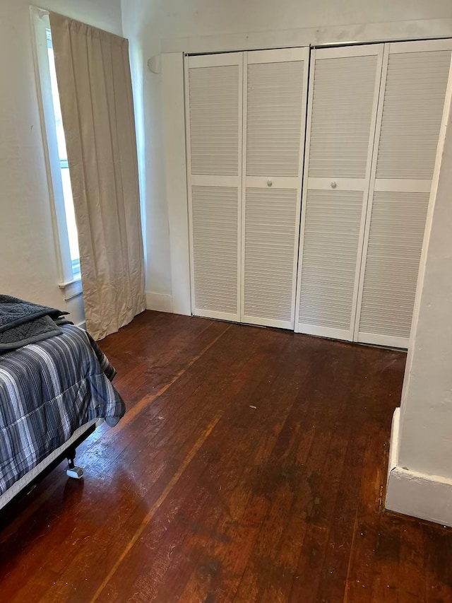 bedroom with hardwood / wood-style flooring