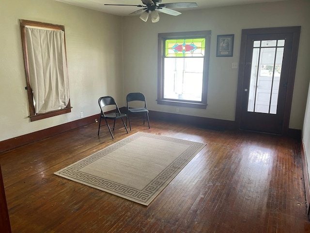 interior space with dark hardwood / wood-style flooring and ceiling fan