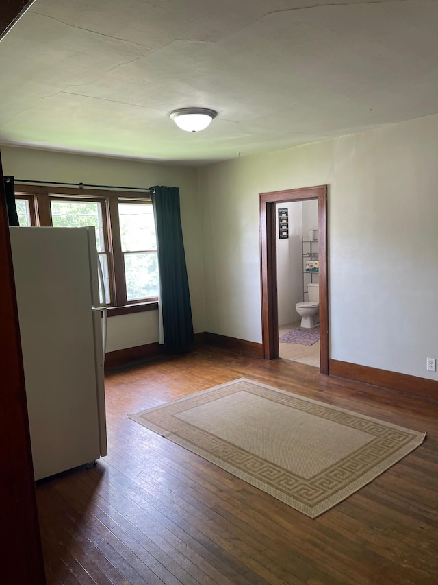 unfurnished room featuring hardwood / wood-style flooring