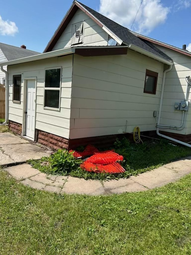 view of home's exterior featuring a yard