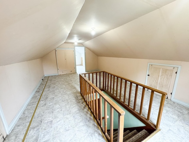 additional living space featuring vaulted ceiling