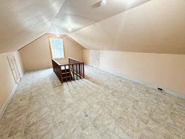 bonus room with vaulted ceiling