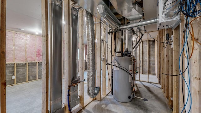 utility room featuring gas water heater