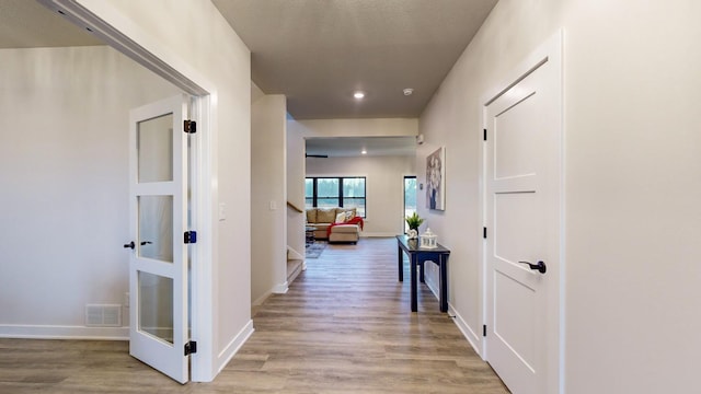 hallway featuring light hardwood / wood-style flooring