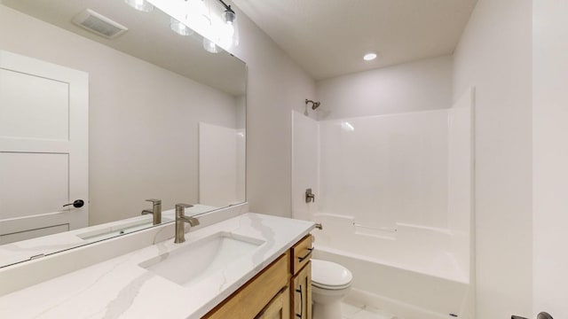 full bathroom with toilet, shower / bathing tub combination, and vanity