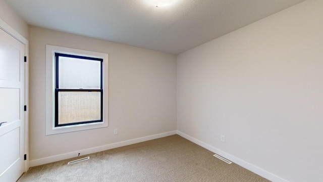 unfurnished room featuring carpet floors