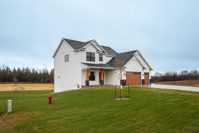 1701 20th Ave Circle NE, Kasson, MN 55944 - modern inspired farmhouse with board and batten siding, concrete driveway, a front yard, and an attached garage