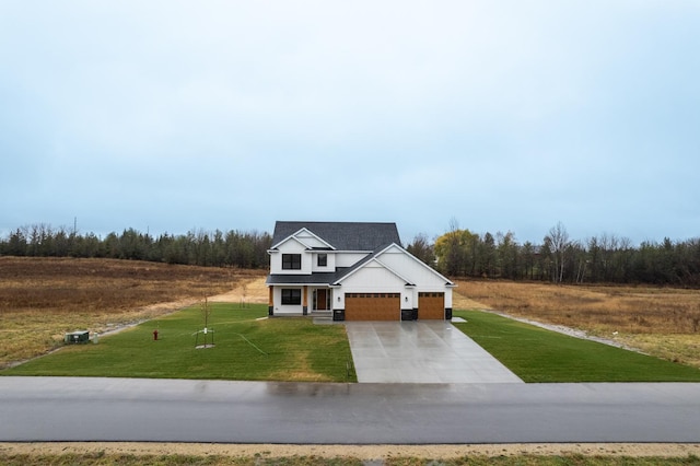 view of front of home with a garage and a front yard