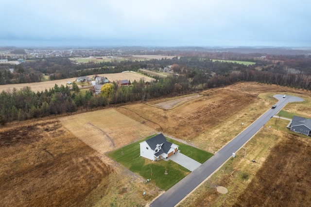 birds eye view of property with a rural view