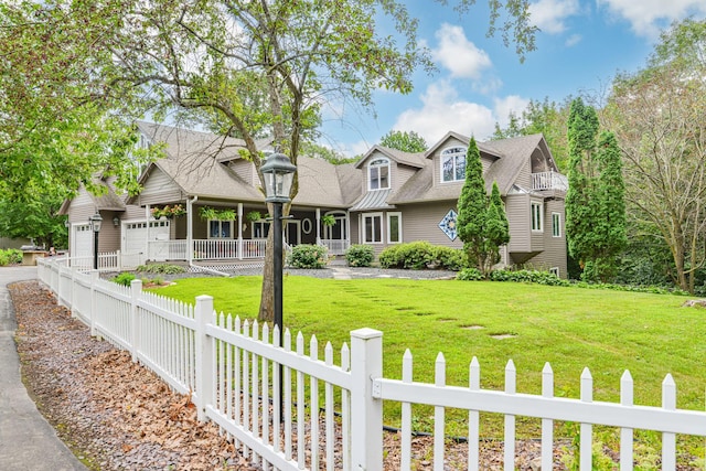 new england style home with a front yard and a porch