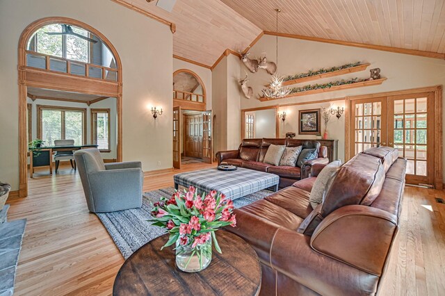 living room with wood ceiling, high vaulted ceiling, light hardwood / wood-style flooring, and french doors