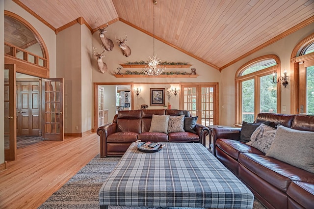 living room featuring wooden ceiling, light hardwood / wood-style flooring, a notable chandelier, french doors, and crown molding