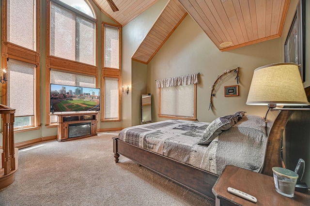 bedroom with high vaulted ceiling, wood ceiling, and carpet