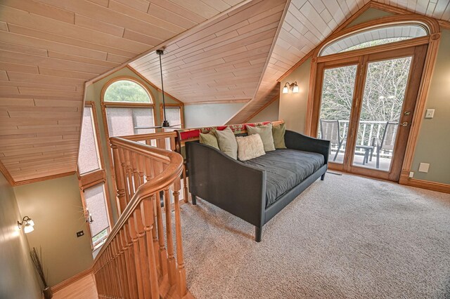 carpeted bedroom featuring access to exterior, vaulted ceiling, and wooden ceiling