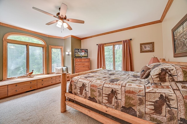 bedroom featuring carpet flooring, ceiling fan, and crown molding