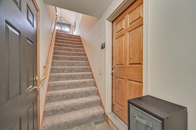 stairs with lofted ceiling