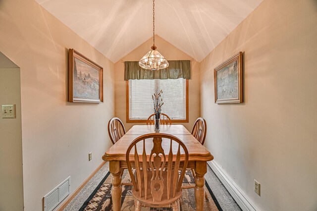 dining space featuring vaulted ceiling, a notable chandelier, and carpet floors