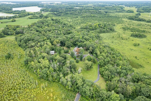 drone / aerial view featuring a water view and a rural view