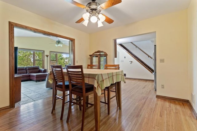 dining room featuring ceiling fan and light wood-type flooring