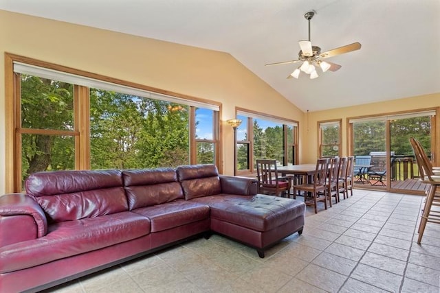 sunroom with ceiling fan, vaulted ceiling, and a wealth of natural light