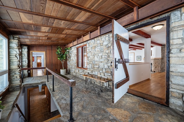 interior space featuring beam ceiling and wood ceiling