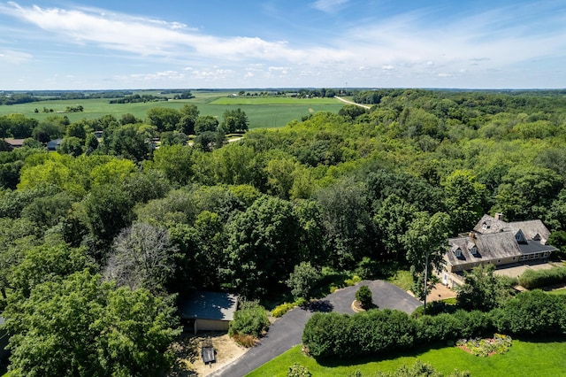 bird's eye view with a wooded view