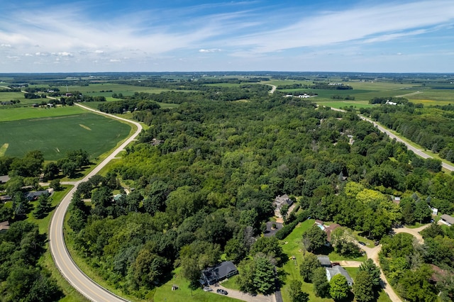 birds eye view of property featuring a rural view and a forest view