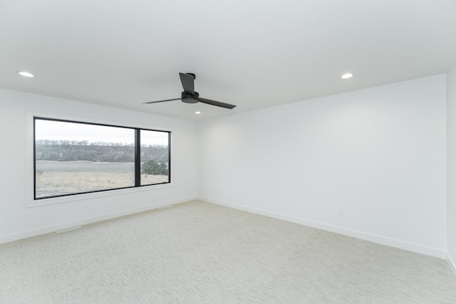 carpeted empty room with ceiling fan