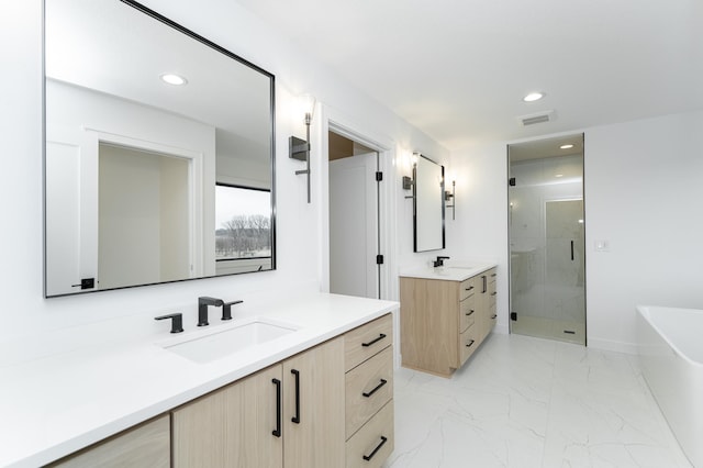 bathroom with independent shower and bath and vanity