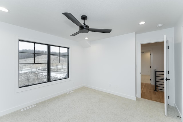 spare room with ceiling fan