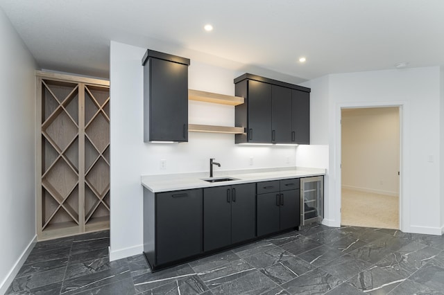 kitchen with wine cooler and sink