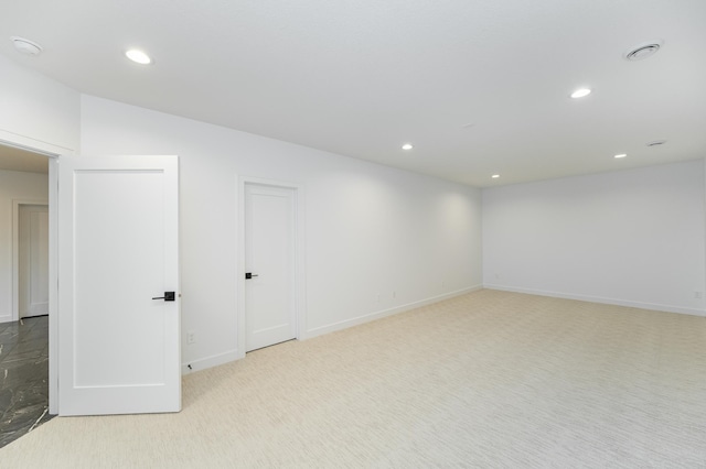 spare room with light carpet