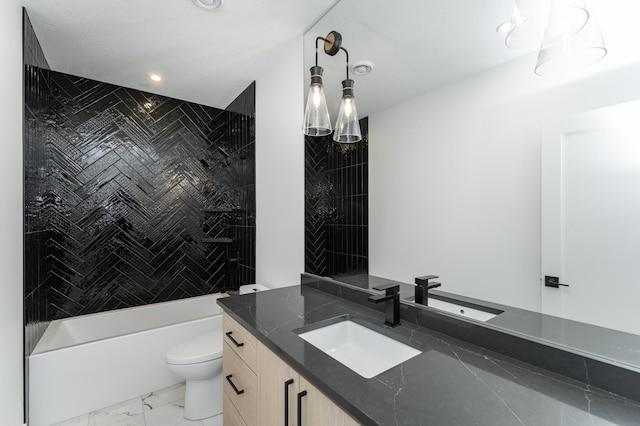 full bathroom featuring vanity, toilet, and tiled shower / bath combo