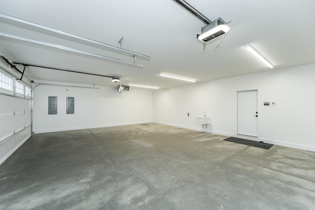 garage with sink, a garage door opener, and electric panel