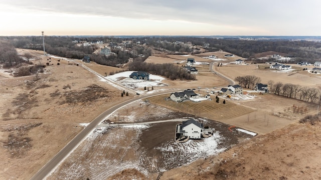 aerial view at dusk featuring a rural view