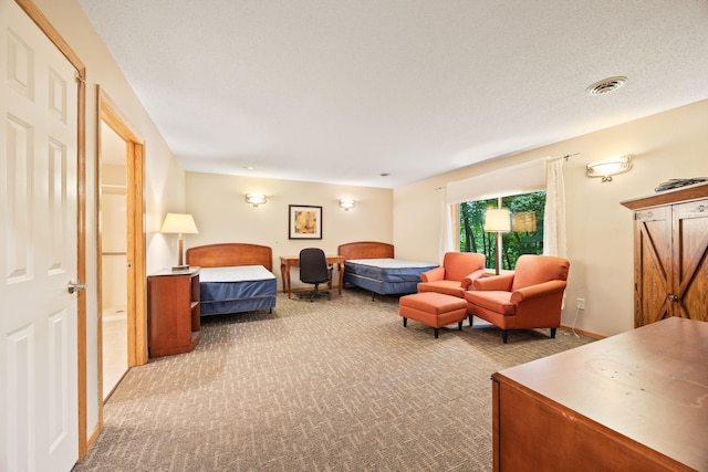 carpeted bedroom featuring a textured ceiling