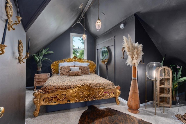 bedroom with lofted ceiling and carpet floors