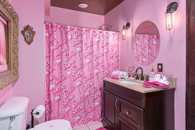 bathroom featuring tile patterned floors, vanity, and toilet