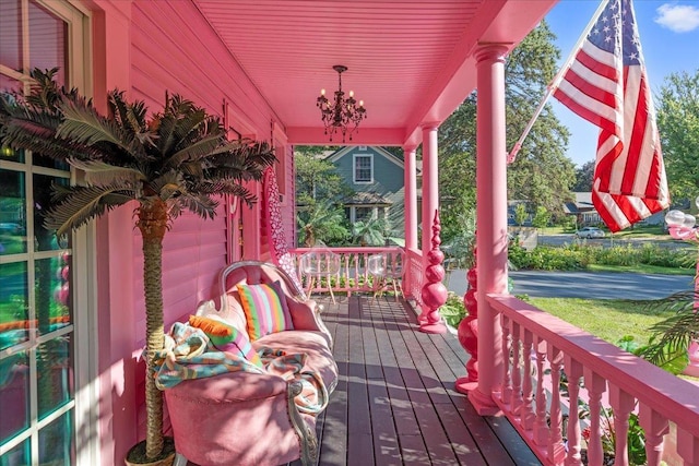 wooden deck featuring a garage