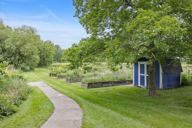 exterior space with an outdoor structure and a yard