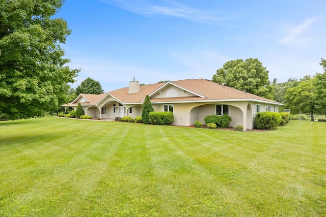 ranch-style house with a front yard