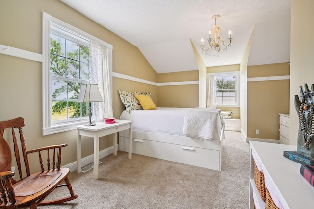 bedroom with baseboards, vaulted ceiling, a notable chandelier, and light colored carpet