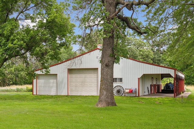 garage featuring a detached garage and driveway