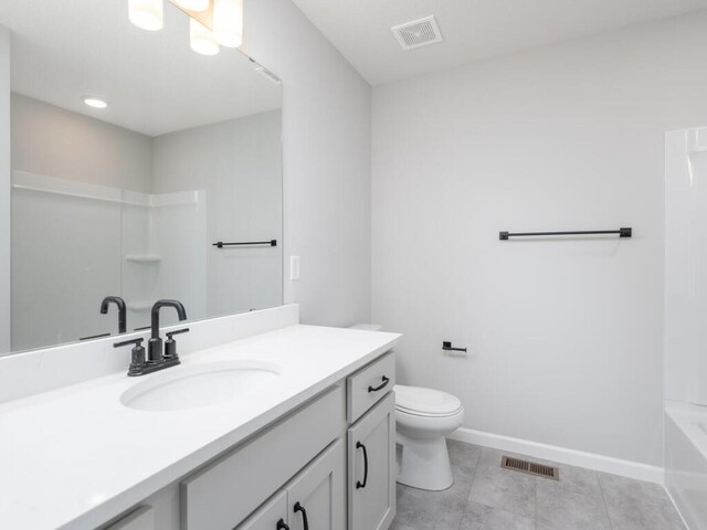 full bathroom with toilet, baseboards, visible vents, and vanity