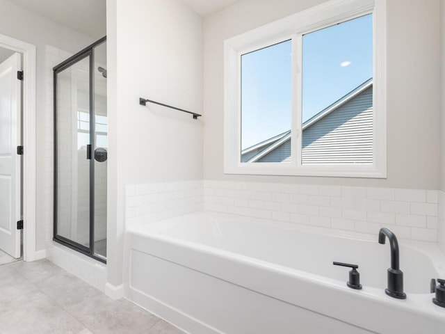 bathroom with tile patterned floors and plus walk in shower